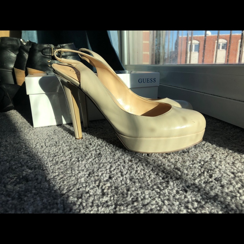 Guess beige high heel shoes.